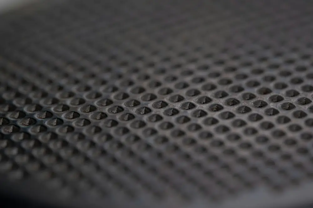 A close-up shows a textured, dark surface, illustrating creative uses of sonic texture